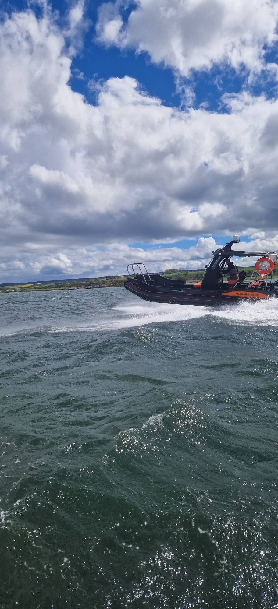 Workboat cutting through waves