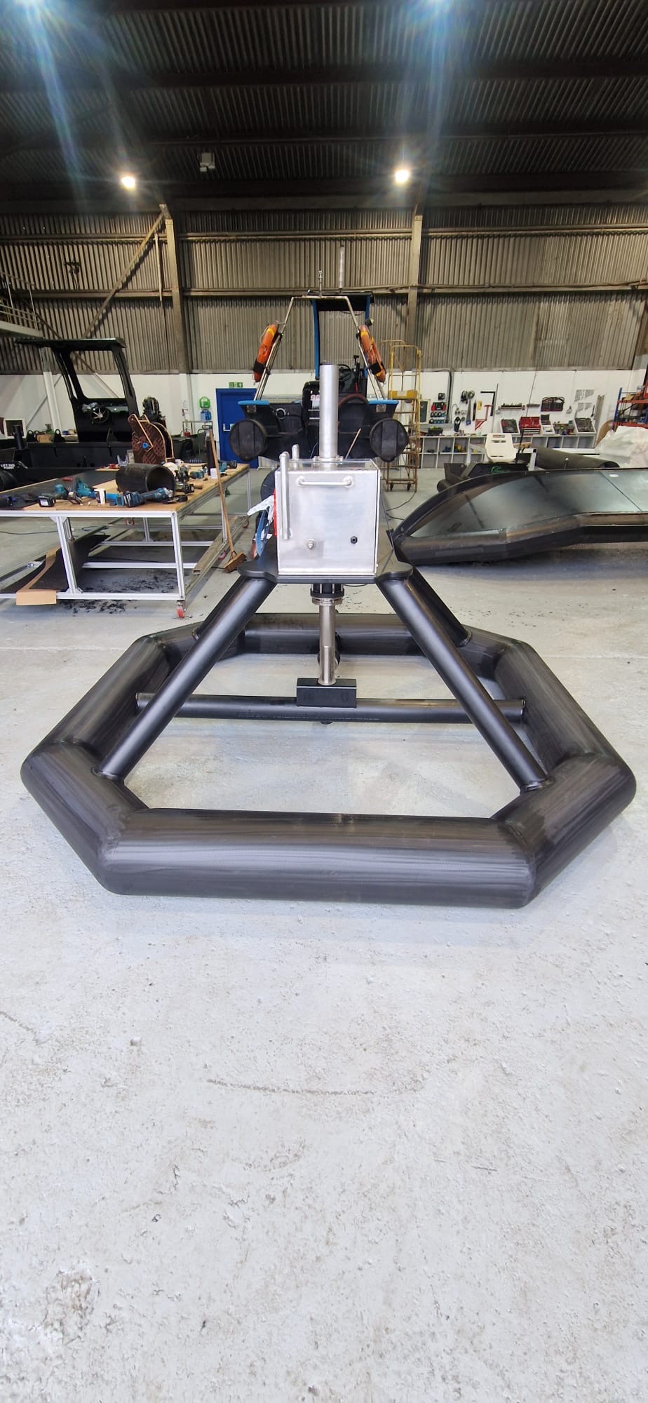 HDPE pontoon base structure with central stainless steel mounting column in the NESS Marine workshop