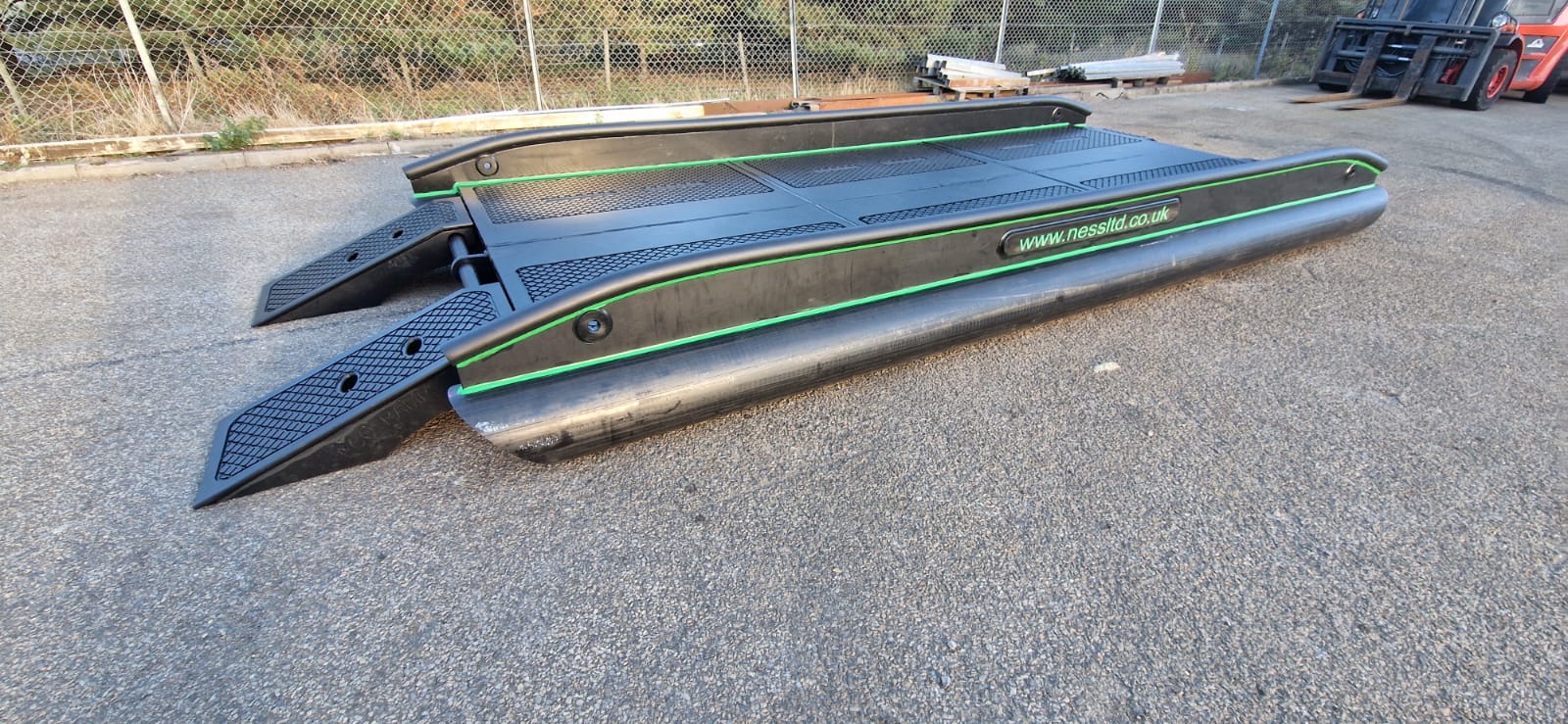 NESS Marine HDPE floating pontoon section with green trim stripe, non-slip deck and www.nessltd.co.uk branding