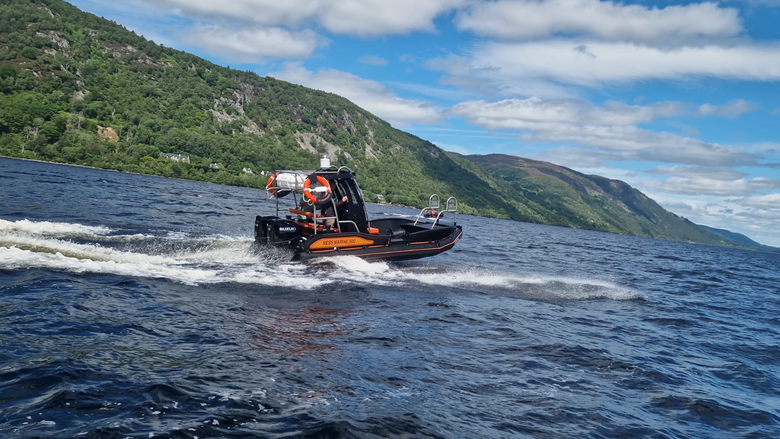 NESS Marine 600 workboat with twin Suzuki outboards running on Loch Ness